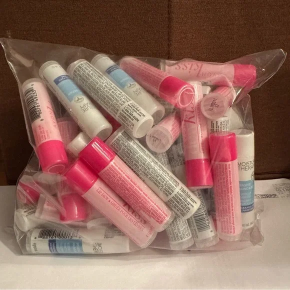 50 Assorted Lip Balms.  Moisture Therapy and Kiss Lip balms. - Picture 2 of 2